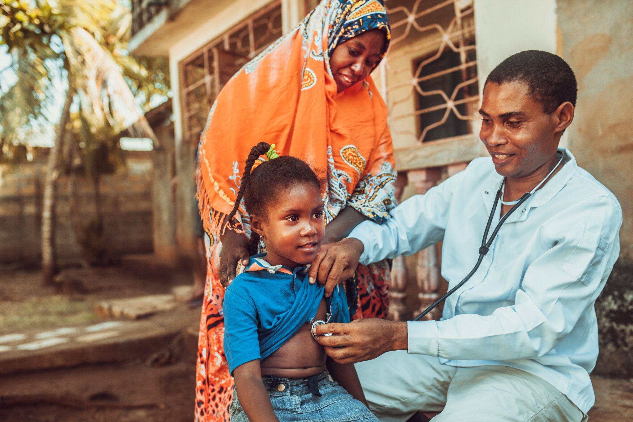 African mother with child at the doctor